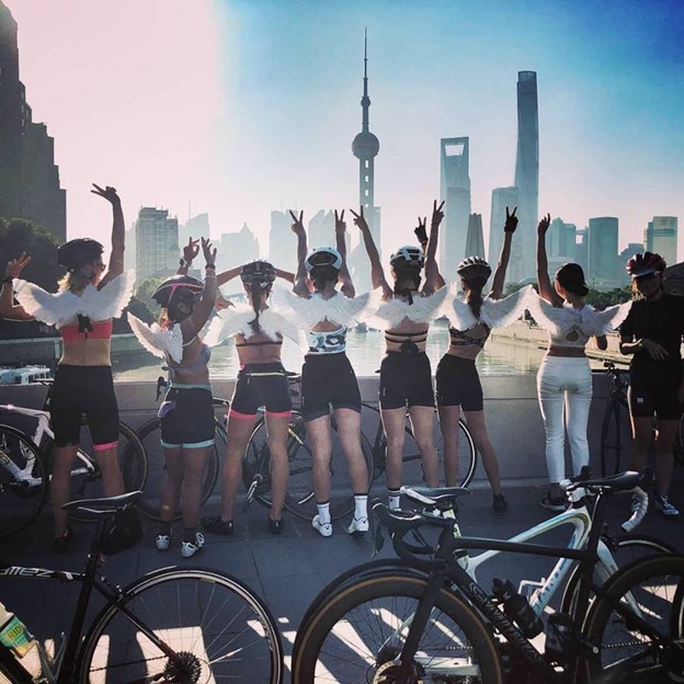 Women that are participating to a group bike ride